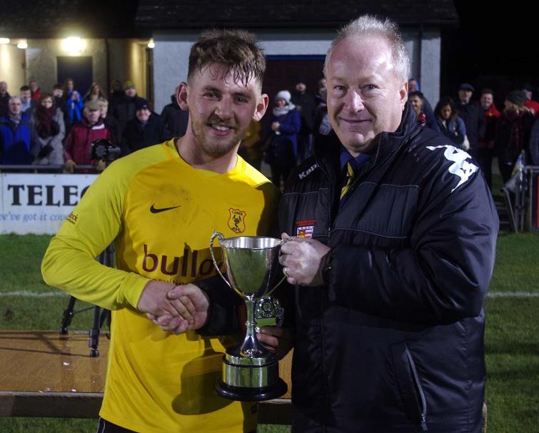 Carew 3rds skipper receives cup from League Council Chairman Steve Briers